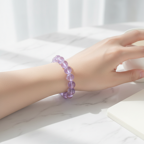 Amethyst crystal bracelet worn on wrist lifestyle photo